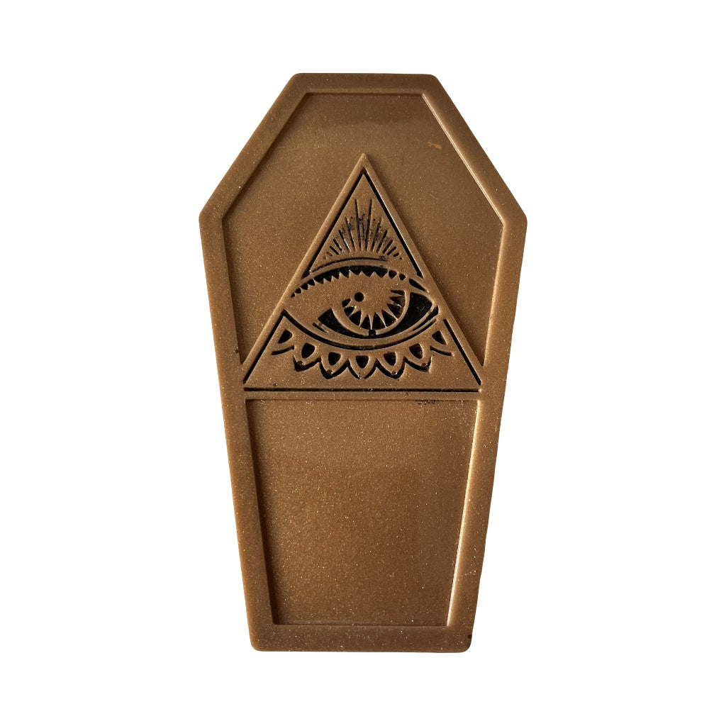 Coffin Shaped Fridge Magnets - A coffin-shaped bronze-coloured metal plaque featuring an embossed All-Seeing Eye of God design in the centre, set against a plain white background.