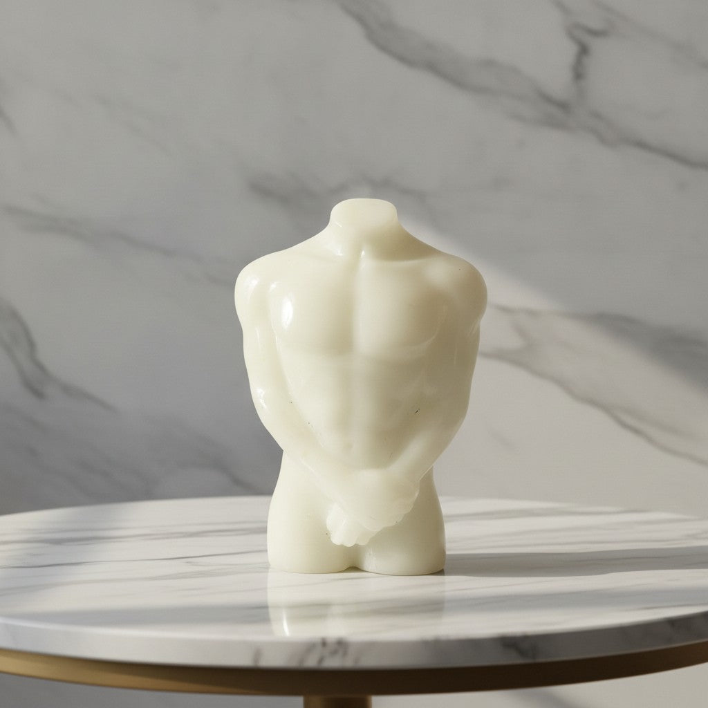Male Torso Figurine, handmade resin ornament showcasing minimalist design and contemporary artistry on a marble table.