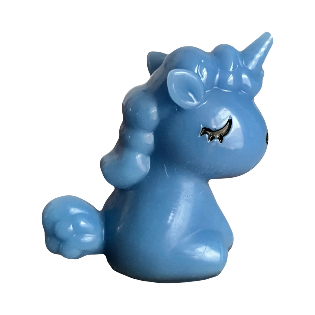 Blue unicorn figurine on a white background